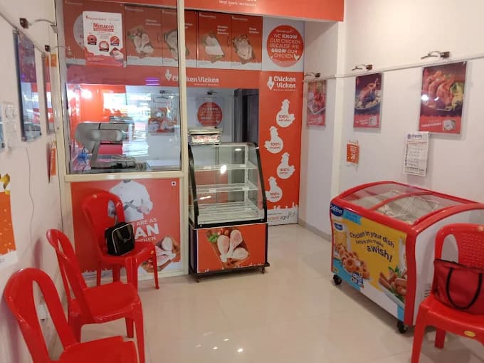 K2 Chicken Shop Interior - Clean, well-lit store with display refrigerators and fresh chicken products